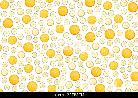 slices of oranges, lemons and limes grouped in random order as wallpaper Stock Photo