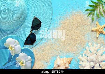 summer-beach-flat-lay-accessories-sunscreen-bottle-cream-towel-and