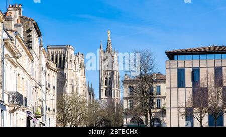 Bordeaux in France, the beautiful Pey Berland tower in the center, in a typical street Stock Photo
