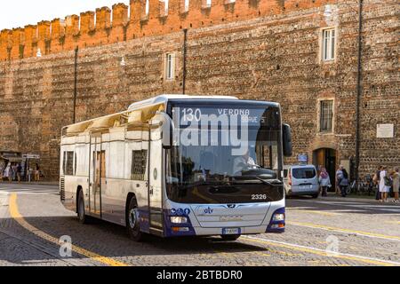 VERONA, ITALY - SEPTEMBER 2018: Public service bus driving along a street in the centre of Verona Stock Photo