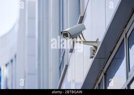 CCTV outdoor camera on a wall Stock Photo