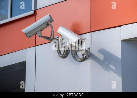 CCTV outdoor camera on a wall Stock Photo