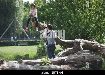 Father taking photograph of daughter Stock Photo