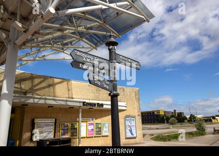 Signpost with directions, next to Conway Park train station, Birkenhead. Located near shopping area, Europa Boulevard, Birkenhead Stock Photo