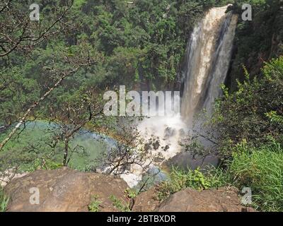 rainbow in the mist of thundering water vapour at Thomson's Falls where the Ewaso Ng'iro river tumbles 74m at Nyahururu, central Kenya, Africa Stock Photo