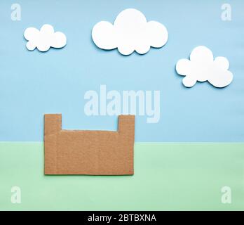 empty cardboard box in the garden made of colored paper Stock Photo