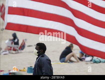 Rye, United States. 24th May, 2020. An America Flag is at half-mast for Memorial Day Weekend at Rye Playland Beach during the Coronavirus Pandemic in New York City on Sunday, May 24, 2020. More than 5.3 million cases of COVID-19 have been reported worldwide resulting in over 343,000 deaths. Photo by John Angelillo/UPI Credit: UPI/Alamy Live News Stock Photo