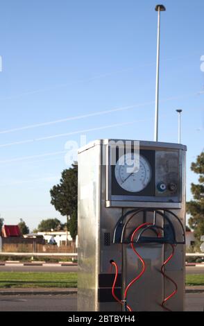 Apparatus for checking the pressure of automobile tires, which is usually close to service stations Stock Photo