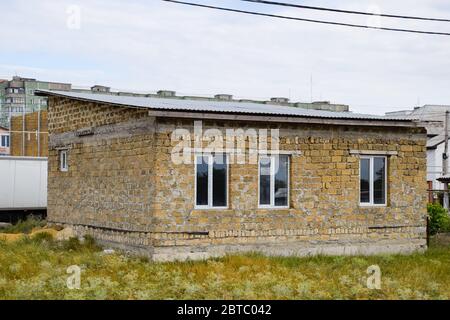 Limestone limestone houses. Building material is limestone. Stock Photo