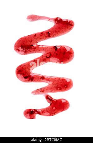 Cherry jam drizzle isolated on white background. Splashes of red berry jam. Top view. Stock Photo