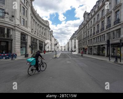 London. UK. May the 24th 2020 at lunch time. Wide view angle of Regent Street. Central london still quite desserted with the stores closed. Just few w