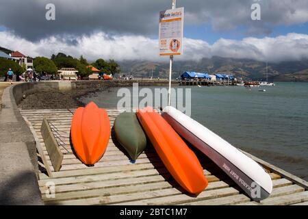 Canoes in French Bay,Akaroa,Banks Peninsula,Canterbury District,South Island,New Zealand Stock Photo