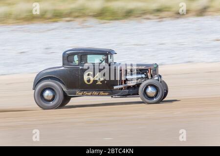 Old American cars Hot Rods on Pendine Sands, Carmarthenshire, Wales UK Stock Photo