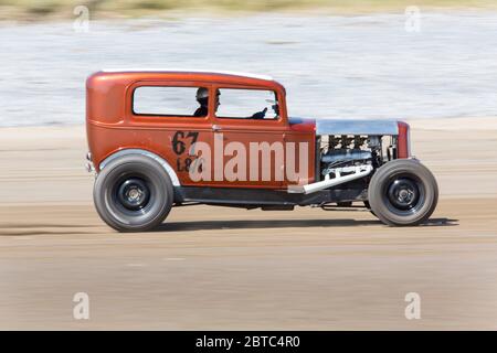 Old American cars Hot Rods on Pendine Sands, Carmarthenshire, Wales UK Stock Photo