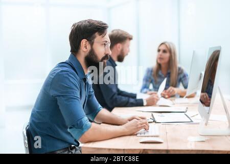 happy businessman looking at his PC screen. Stock Photo