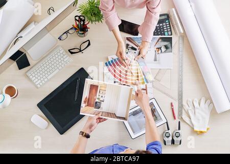 Designers choosing color scheme for living room of client, view from above Stock Photo