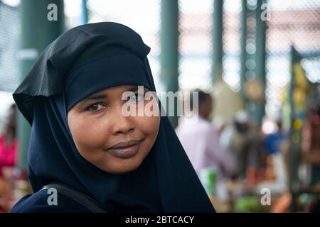 Smiling Muslim woman at the Mombasa public market Stock Photo