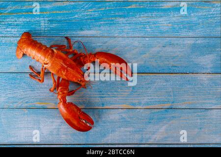 Cooked lobster with dinner on wooden plate of background Stock Photo