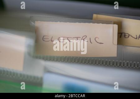 A label within a file organiser with the wording Electricity.Normally a place where household bills and other important documents are kept. Stock Photo