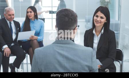 business woman discussing something with a colleague before a business meeting Stock Photo