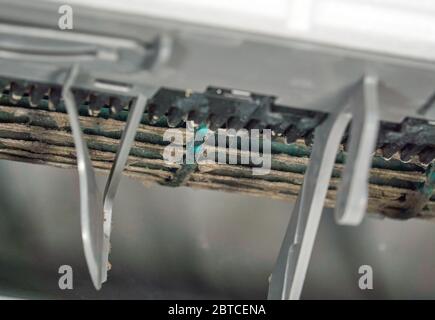 Mold and dust inside of air conditioner, close up picture, selective focus. Mold and dust inside of air conditioner can be dangerous for health and ca Stock Photo