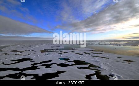 The clouds begin to thin over the Arctic Ocean Aug. 19, 2009. Stock Photo