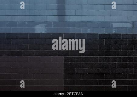 Dark painted brick wall, grunge background Stock Photo