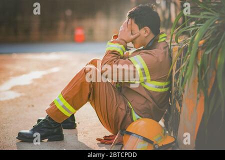 Asian male and female firefighter portrait, young smiling fireman in uniform 367 Stock Photo