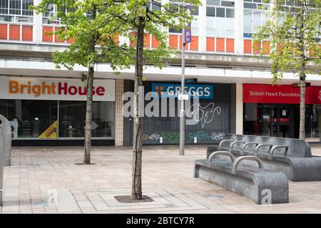 Sheffield UK –  April 30 2020: a closed retail outlet, food take out and charity shop - non-essential businesses cease trading in Sheffield during the Stock Photo