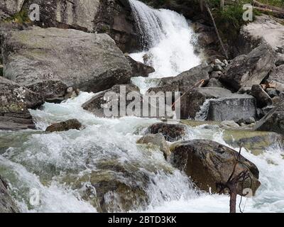 Lake and waterfall in the mountains Stock Photo