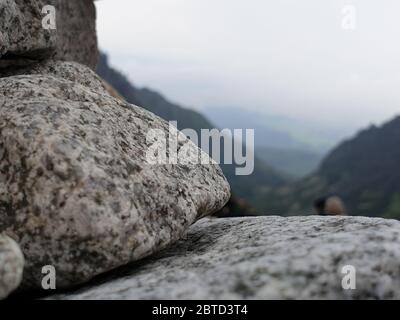 Close up of stone with mountains in the background Stock Photo