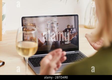 Happy son on laptop monitor talking to his mother online because of self isolation and quarantine Stock Photo