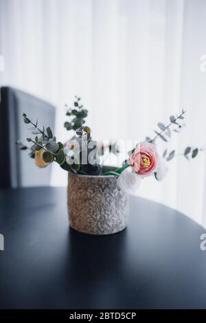 Original wedding floral decoration in the form of mini-vases and bouquets of flowers Stock Photo