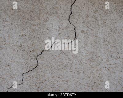 Cracked building damage in a wall Stock Photo