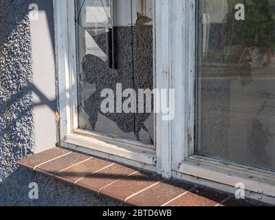 Broken window after a break-in Stock Photo