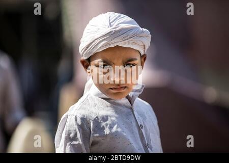 New Delhi, India. 25th May, 2020. A boy is seen celebrating Eid al-Fitr outside his home during lockdown to curb the spread of COVID-19, in New Delhi, India, May 25, 2020. Credit: Javed Dar/Xinhua/Alamy Live News Stock Photo