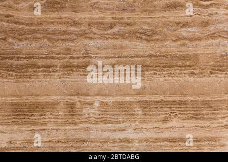 Beige, brown natural travertine stone texture close-up. Stock Photo