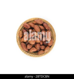 Peanuts in wood bowl close up isolated on white background. Stock Photo