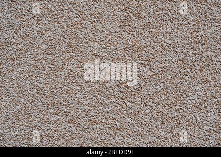 close view of the wall surface, decorative finishing, heat insulation granules or granite particles Stock Photo
