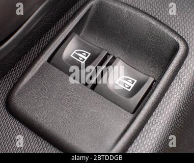 Two front and rear power windows control buttons in a modern car, background, comfortable Stock Photo