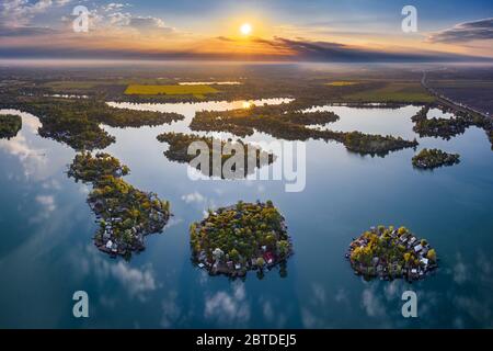Budapest, Hungary - Aerial view of Lake Kavicsos (Kavicsos to) of Csepel district with small fishing islands on it. Fishing huts, piers and cabins on Stock Photo