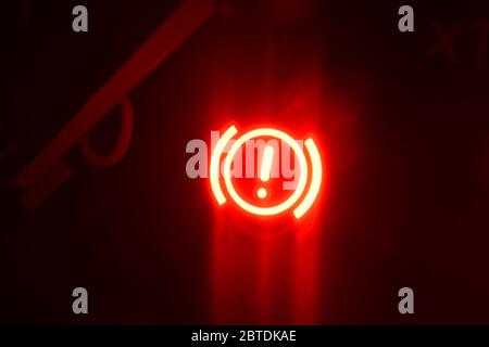 dashboard warning light flashing on vehicle at night Stock Photo