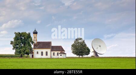 church with satellite dish, Ground Sending Plant Raisting, Germany, Bavaria Stock Photo