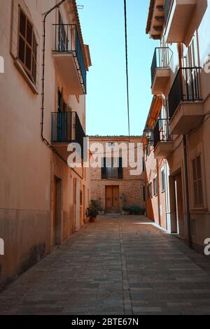 Narrow alley and Mediterranean architecture on the island of Mallorca, Spain. Stock Photo