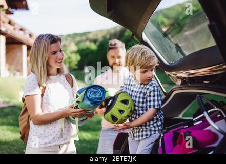 Family with small child going on cycling trip in countryside. Stock Photo