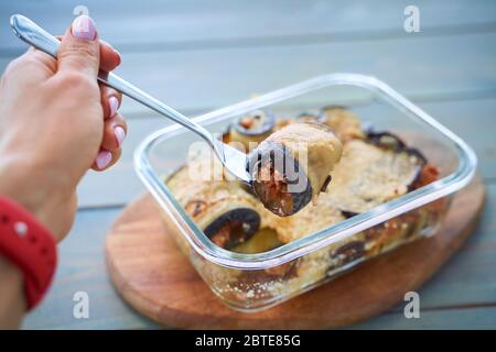 rolls with zucchini and minced meat on a cutting board closeup. Stock Photo