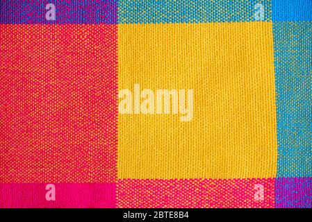 Colored fabric, cloth with abstract checkered pattern, as texture or background, top view Stock Photo