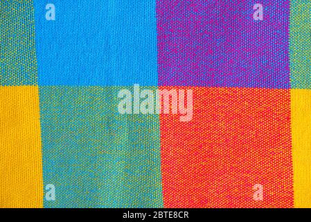 Colored fabric, cloth with abstract checkered pattern, as texture or background, top view Stock Photo