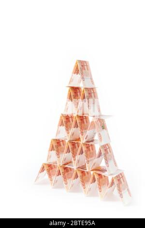 House of cards from Russian money. Pyramid from the bills. White background. Isolate. Stock Photo