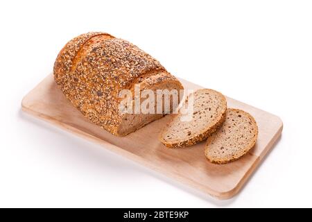 Sliced Loaf Of Bread On A Cutting Board Isolated On White Stock Photo